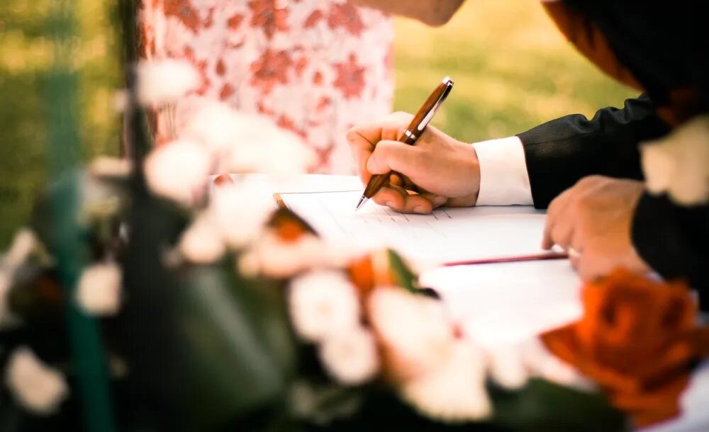 signing guest book at a wedding
